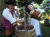 Rich Wagner and assistant make beer at the brewfest