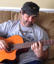 a musician, playing guitar with many artists including Craig Morgan, Jeff Carson, Kevin Denney, Johnny Lee, and Sherrie Austin